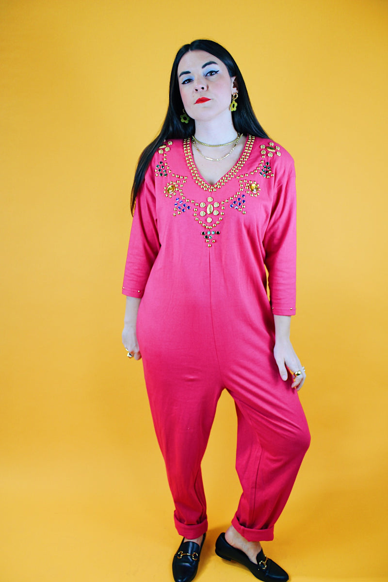 long sleeve hot pink jumpsuit with jewels around neckline and cuffs vintage 1980's