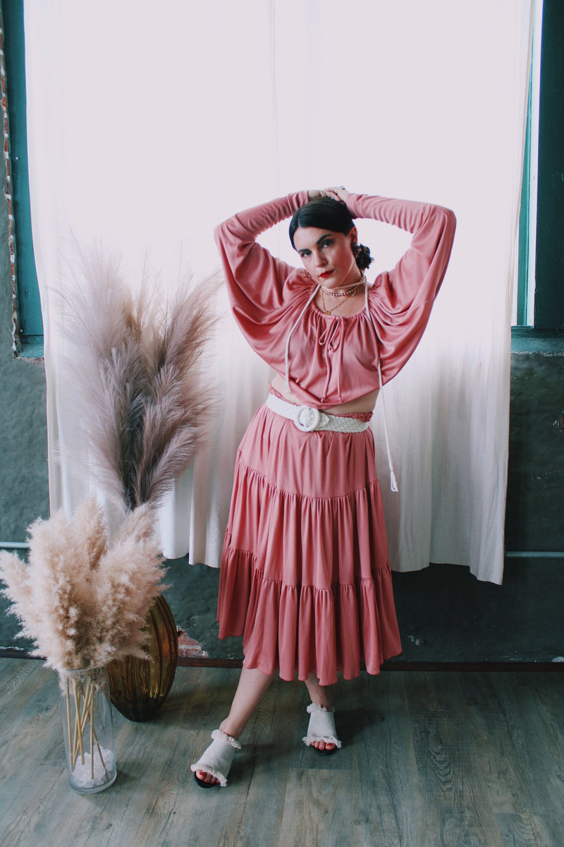 Women's vintage 1970's Joy Stevens California label salmon pink colored matching long sleeve dolman cropped top and pleated midi skirt in polyester material.