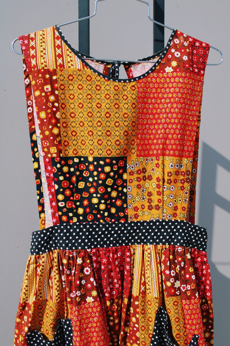 yellow  red brown and black printed sleeveless ankle length apron pinafore dress vintage 1970's