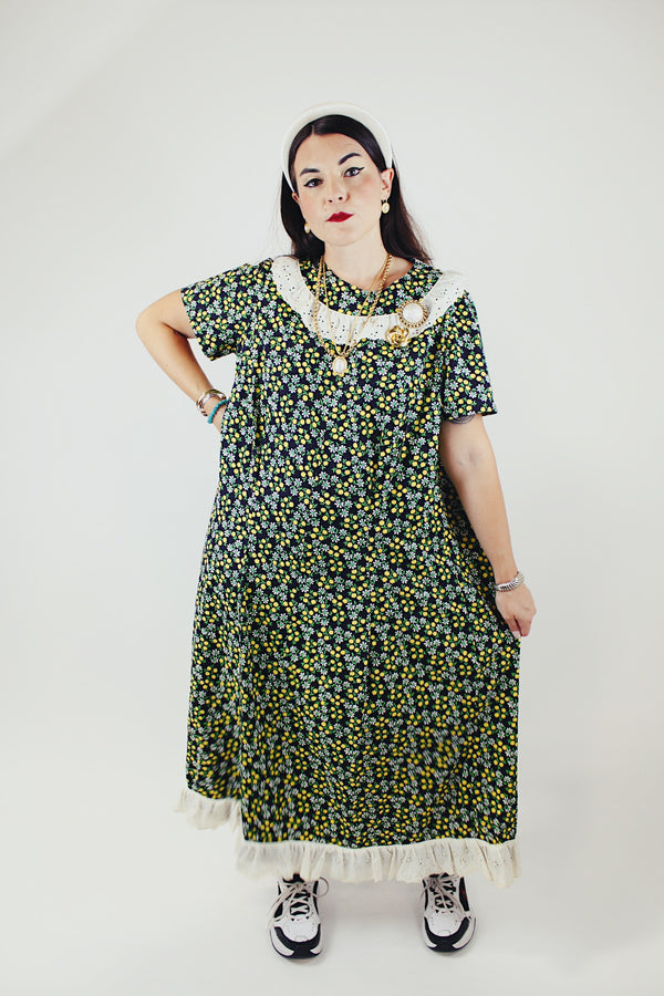 short sleeve ankle length black green and yellow floral printed dress with white eyelet trim vintage 1960's