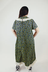 short sleeve ankle length black green and yellow floral printed dress with white eyelet trim vintage 1960's