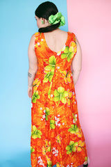 Women's vintage 1970's ears Hawaiian Fashions label sleeveless cotton material ankle length orange dress with all Hawaiian floral print.