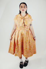 short sleeve midi length orange and pink paisley print a line dress vintage 1950's