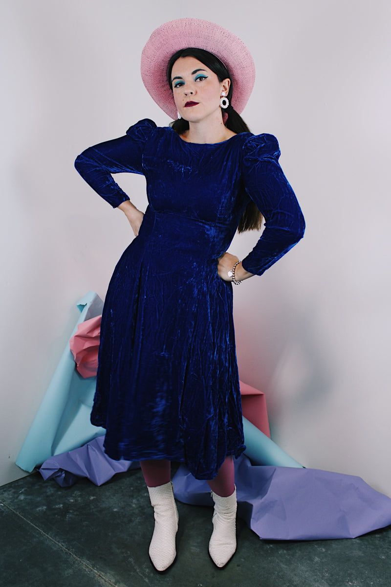 Women's vintage 1960's long sleeve midi length blue velvet dress with slight puff sleeves