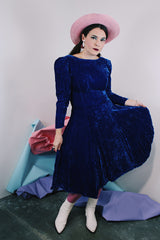 Women's vintage 1960's long sleeve midi length blue velvet dress with slight puff sleeves