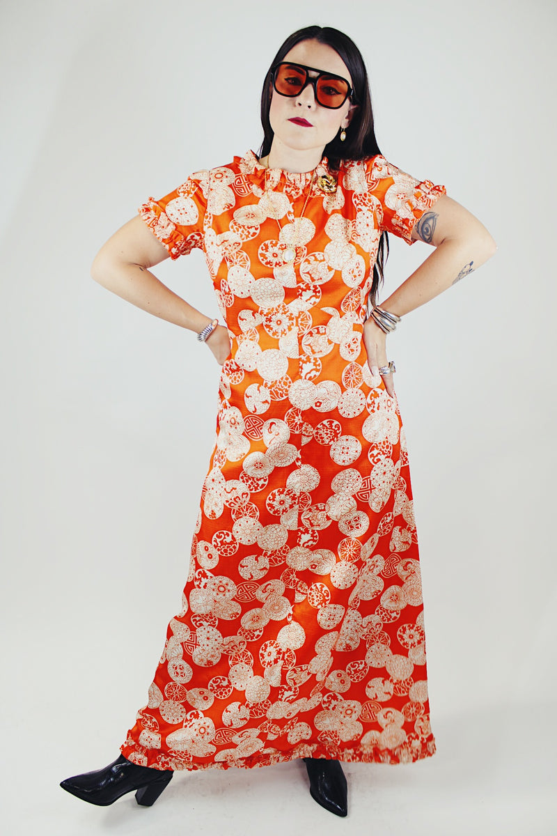 short sleeve maxi length orange printed dress with ruffle trim vintage 1970's