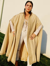 beige wool poncho ape with beaded and gold ribbon trim and pointy collar vintage women's 1960's