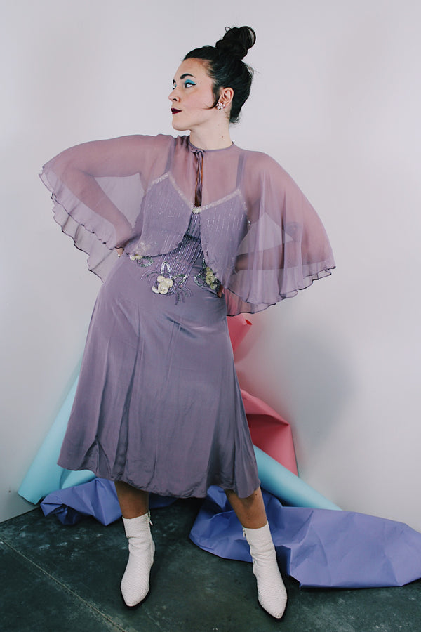 Women's vintage 1980's 100% silk light purple dress with beaded chest, spaghetti straps, V shaped neckline, and a midi length and comes with a matching sheer silk caplet