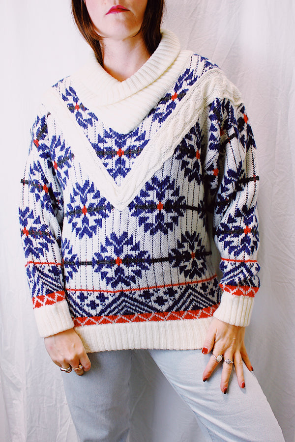 long sleeve pullover sweater white with blue and red snowflake print, rolled v-neck collar 1980's vintage