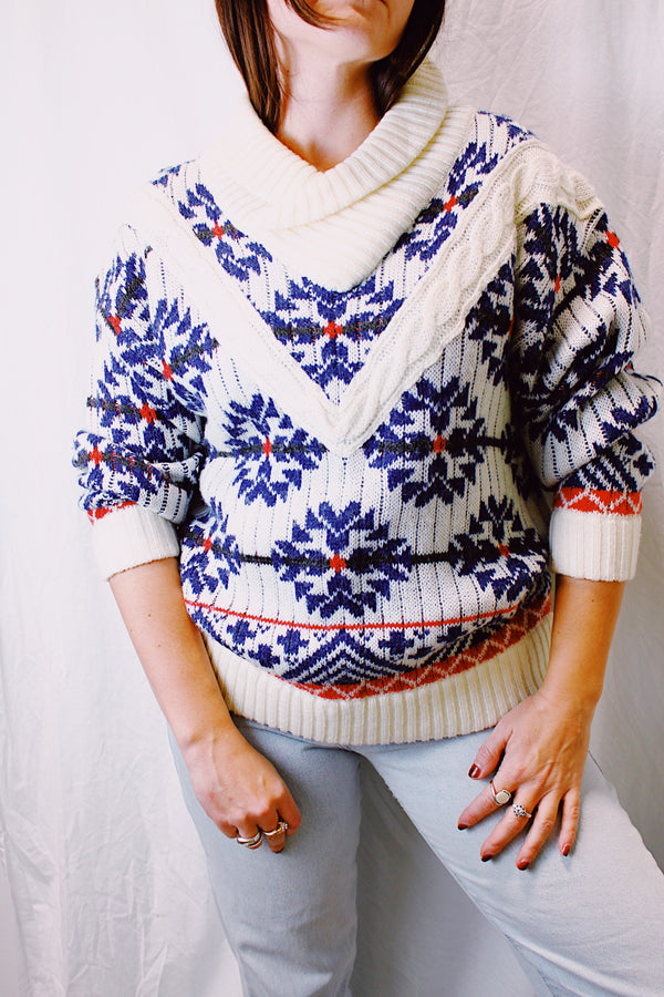 long sleeve pullover sweater white with blue and red snowflake print, rolled v-neck collar 1980's vintage