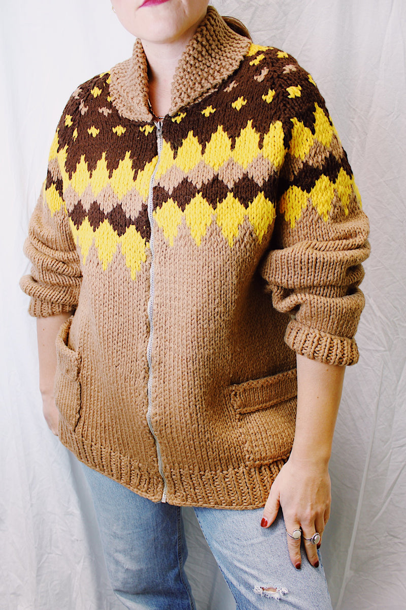 long sleeve zip up cowichan style sweater in camel brown with dark brown and yellow print around neck