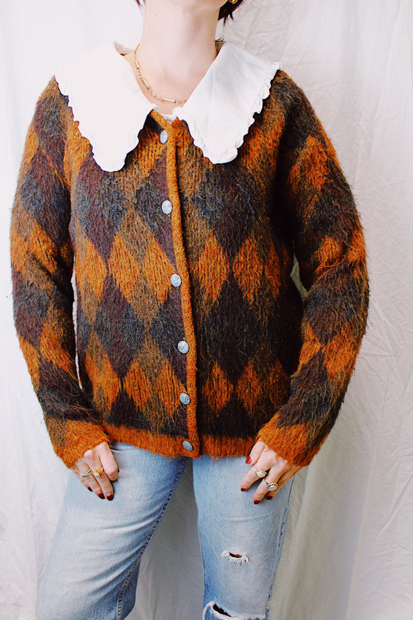 long sleeve acrylic sweater with silver metal buttons in orange and brown argyle print