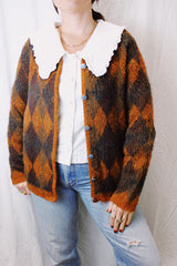 long sleeve acrylic sweater with silver metal buttons in orange and brown argyle print