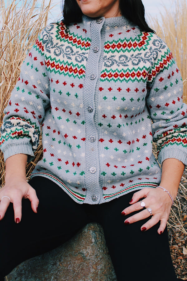 long sleeve grey wool norwegian sweater with red and green and white print and silver buttons