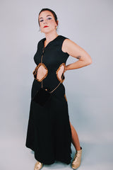 vintage 1970's ankle length black sleeveless dress with waist cut outs that have gold sequined trim