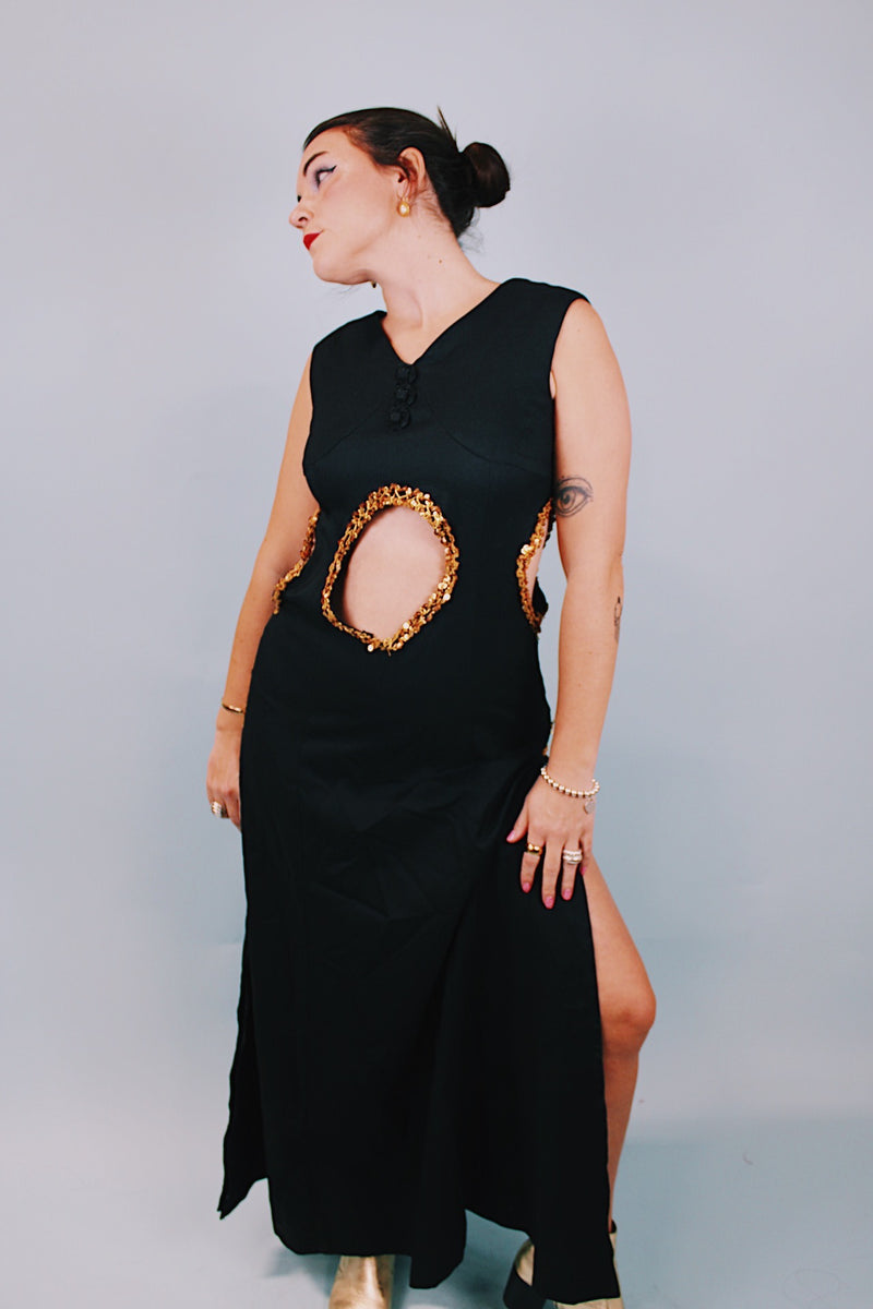 vintage 1970's ankle length black sleeveless dress with waist cut outs that have gold sequined trim