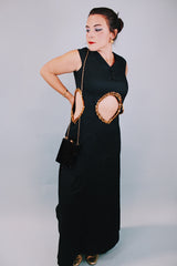 vintage 1970's ankle length black sleeveless dress with waist cut outs that have gold sequined trim