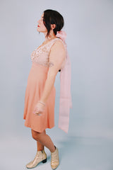 salmon colored 1960's vintage dress and jacket set dress is sleeveless and has beaded top