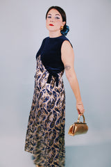 vintage 1970's sleeveless ankle length dress with navy velvet top half and gold metallic paisley printed bottom half