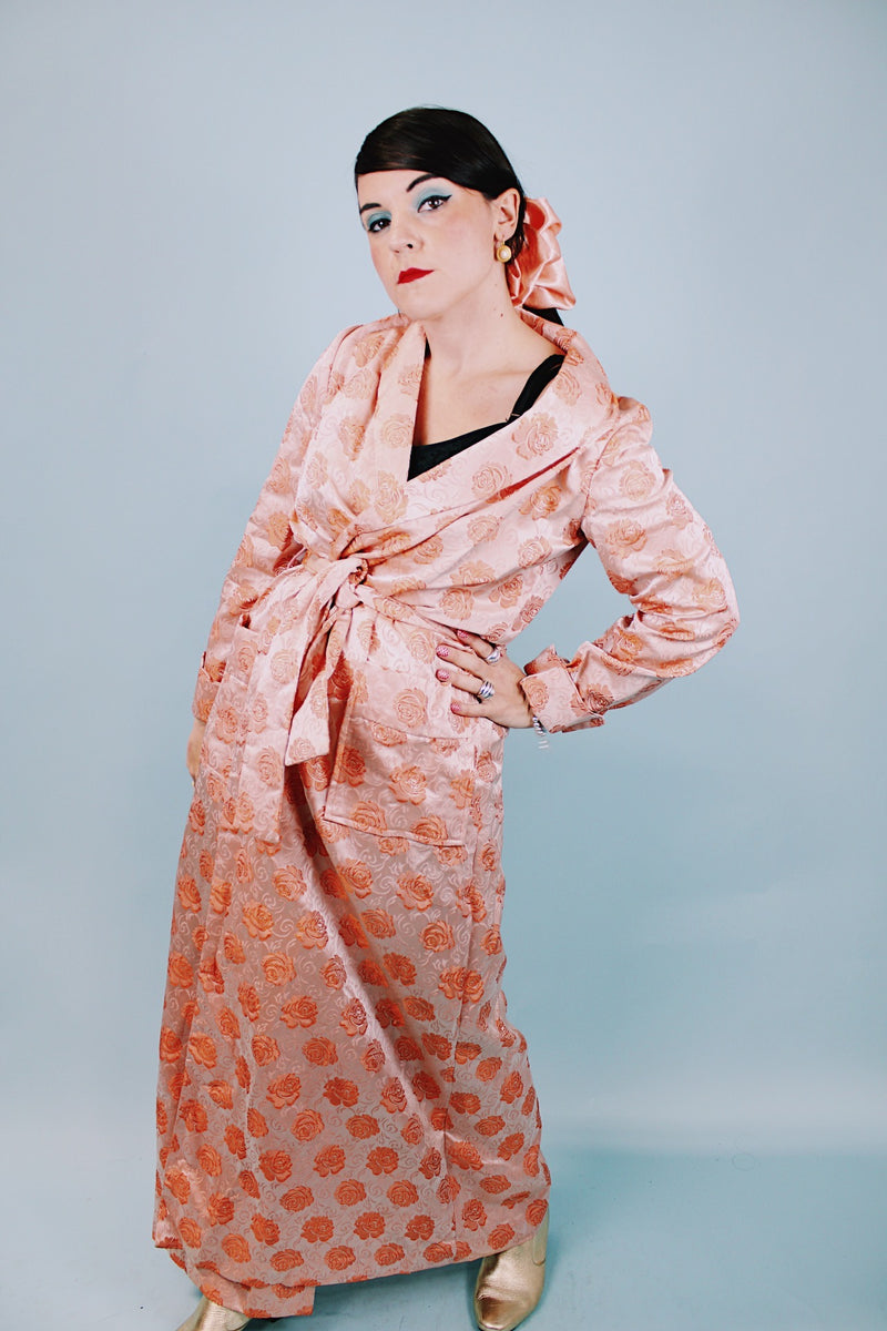 long sleeve peach colored 1950's silky shiny robe with rose print all over