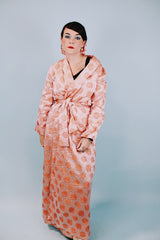 long sleeve peach colored 1950's silky shiny robe with rose print all over