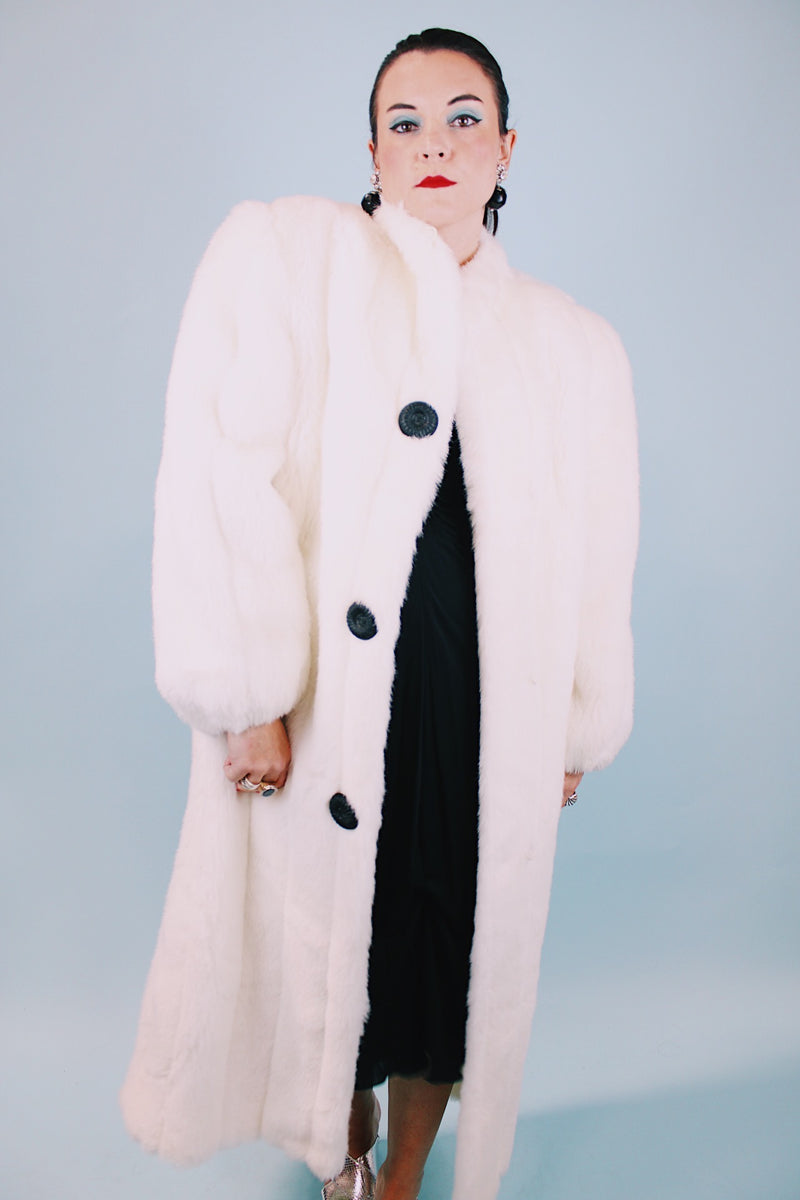 long sleeve ankle length vintage 1980's white faux fur coat with black buttons and mandarin collar