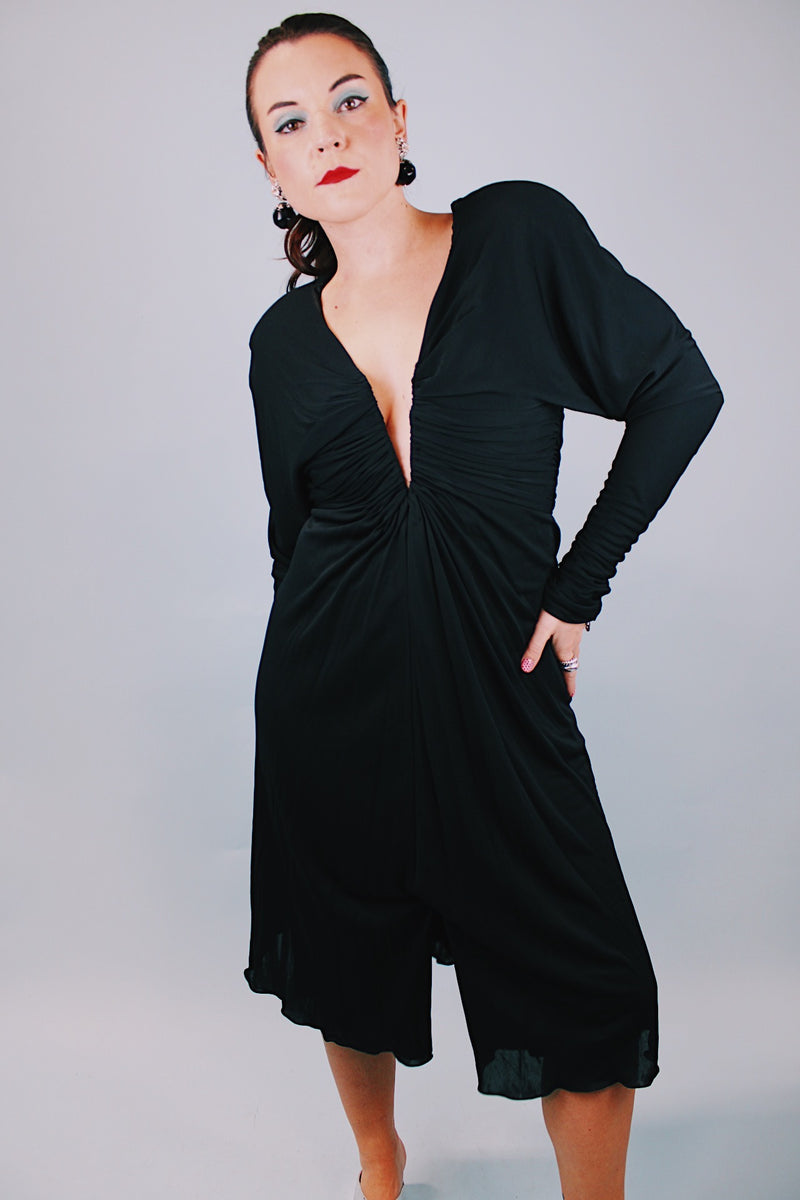 long sleeve mini black dress with deep v-neck and cinched arms 1980's vintage