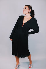 long sleeve mini black dress with deep v-neck and cinched arms 1980's vintage