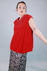 sleeveless red velvet blouse with v neck in front and back with embellished trim around neckline and bow in back 1950's vintage