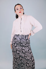 long sleeve white blouse with buttons in the back and chiffon ruffle details around cuffs and neck vintage 