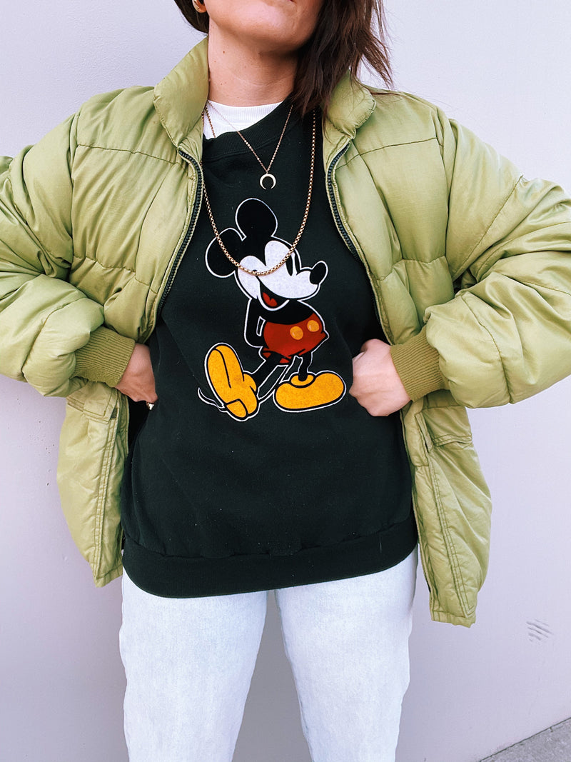 long sleeve pullover sweater in black with felt mickey mouse graphic on front