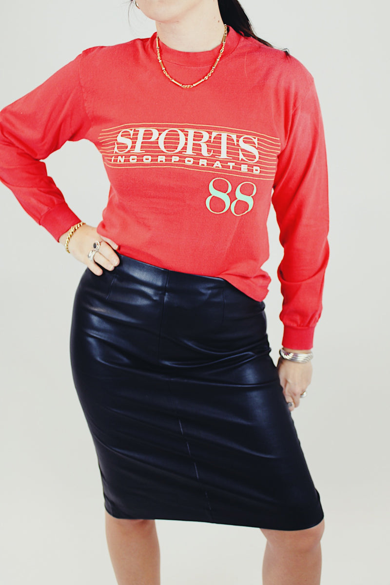 long sleeve red tee with sports incorporated 88 written on front