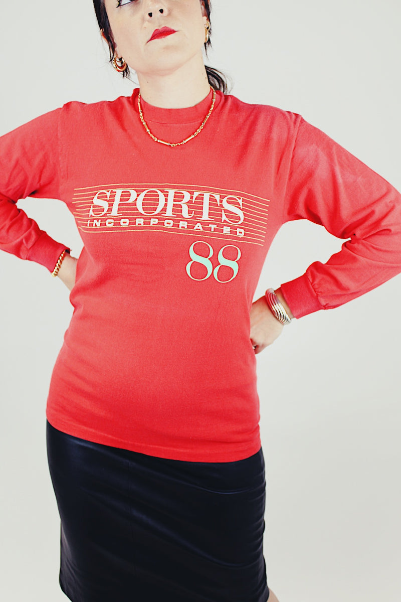 long sleeve red tee with sports incorporated 88 written on front