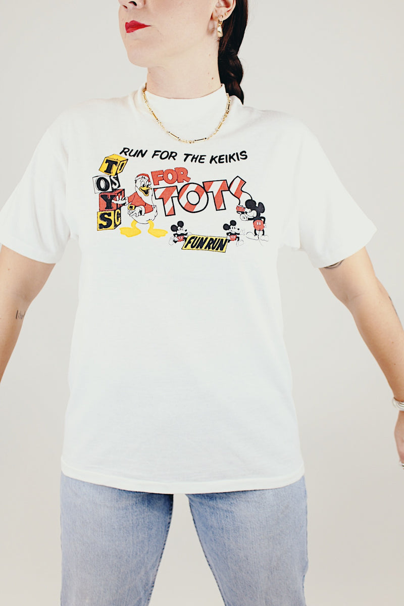 short sleeve white vintage t-shirt with for tots fun run graphic on front 