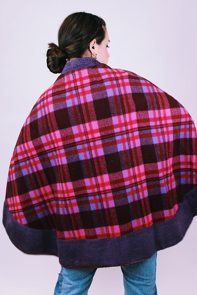  purple and pink plaid vintage women's poncho with mandarin collar, buttons, and armholes made of wool blend