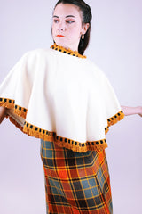 women's 1950's cream wool poncho with orange yarn fringe hem and neck
