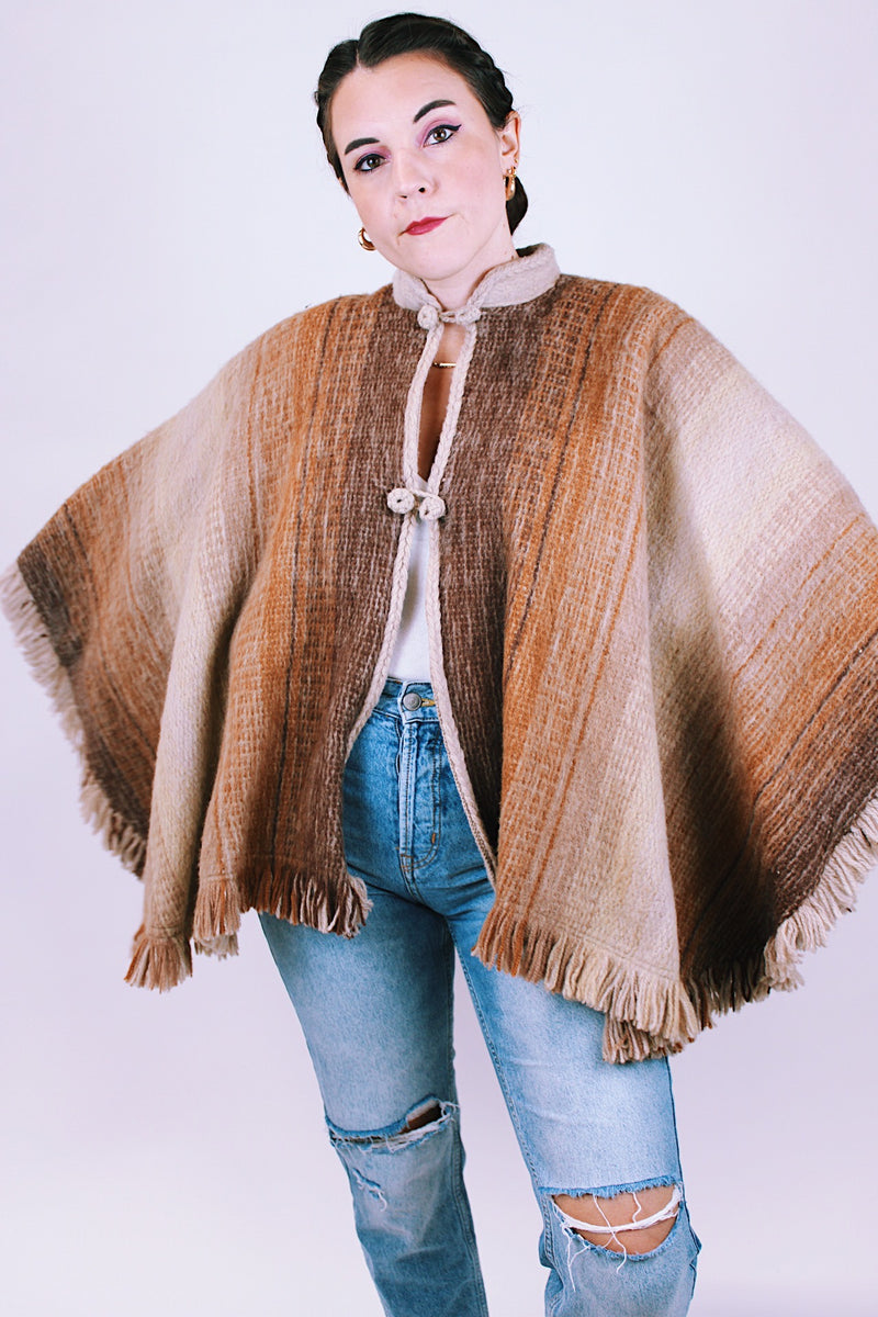 brown wool poncho with mandarin collar and two button closure 