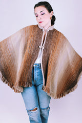 brown wool poncho with mandarin collar and two button closure 