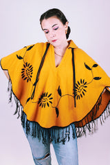 mustard yellow women's vintage wool poncho with black fringe and small collar and embroidered flowers