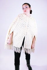 women's 1970's vintage cream acrylic knitted crochet poncho with fringed hem, collar, and buttons