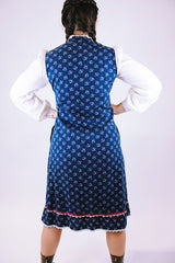 1970's vintage gunne sax prairie dress with navy floral body and white sheer sleeves buttons up the front
