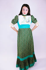 1970's vintage prairie dress in green ditsy floral print, crochet sleeves mock neck embroidered butterflies on chest 