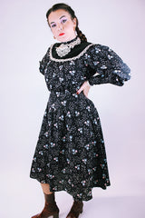 vintage 1970's gunne sax dress with long sleeves in black with ditsy floral print has lace trim and mock neck 