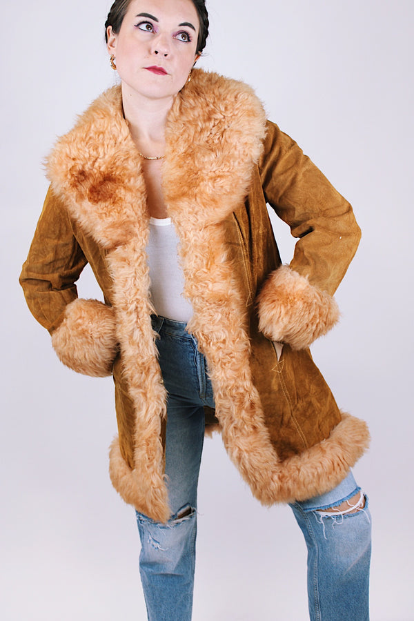 women's vintage 1970's suede leather jacket with faux fur  around edges, hem, and cuffs