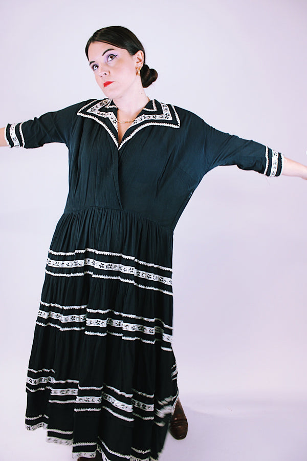 1950's vintage women's dress black with white and silver metallic ribbon applique throughout