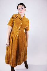short sleeve women's vintage 1950's mustard yellow velvet dress midi length with collar and buttons in the front