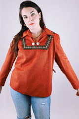 long sleeve pullover blouse in a soft faux suede burnt orange fabric with collar