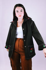 long sleeve women's vintage 1970's button up blouse with collar and pockets in chocolate brown has embroidered flowers