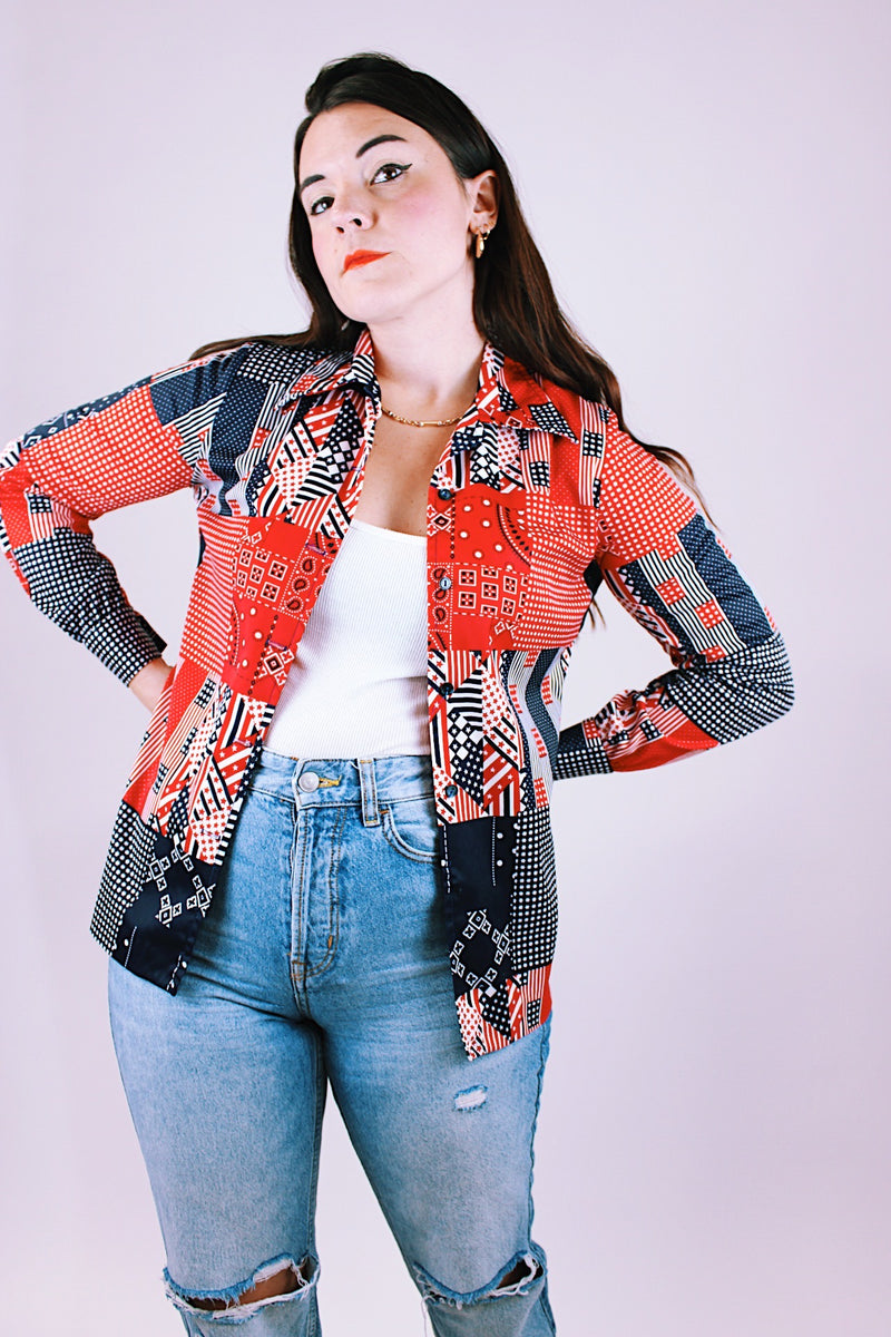 women's vintage 1970's long sleeve button up blouse in a navy and red patchwork print polyester