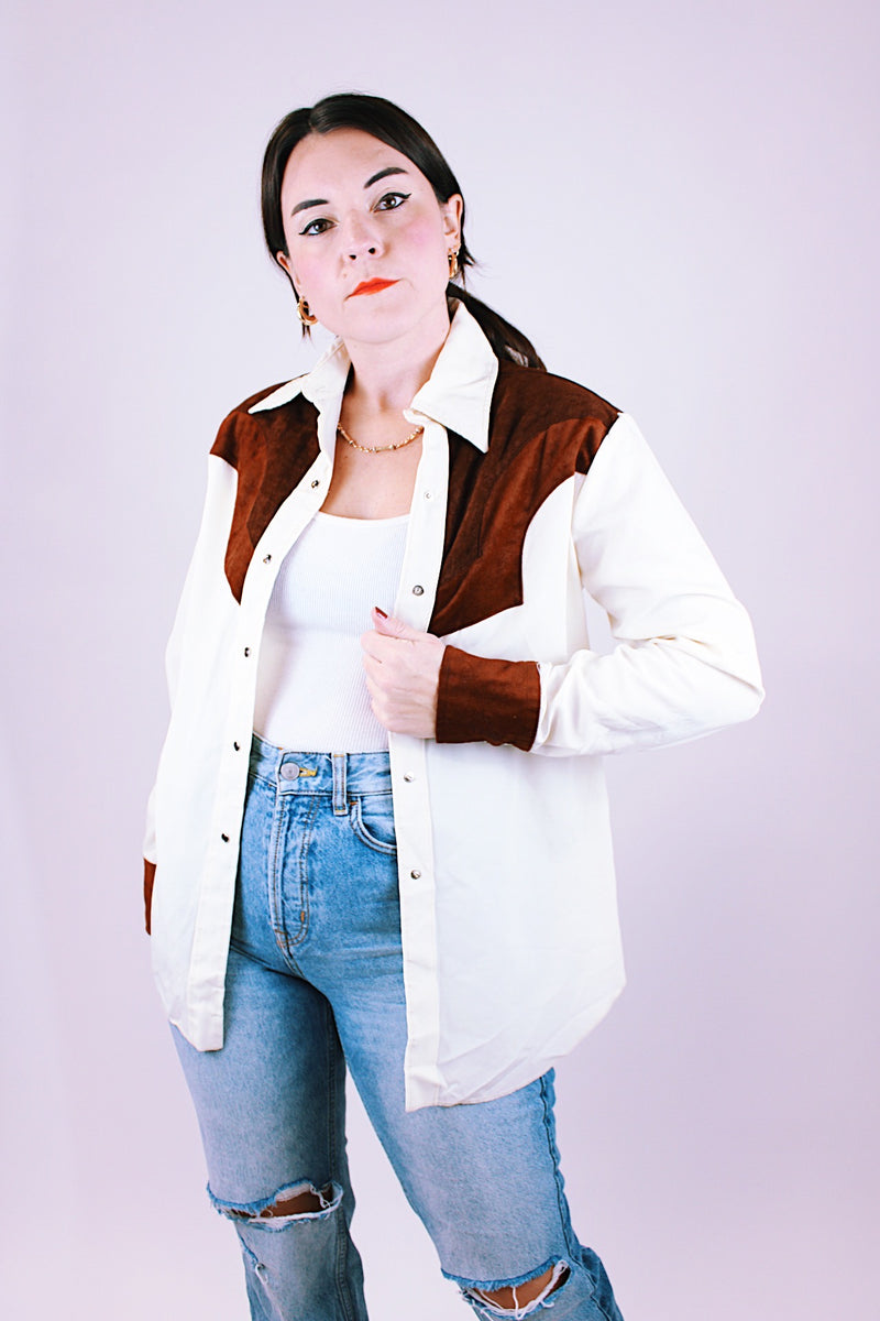 women's 1980's long sleeve popper button up western style blouse in white with brown faux suede panels and has collar